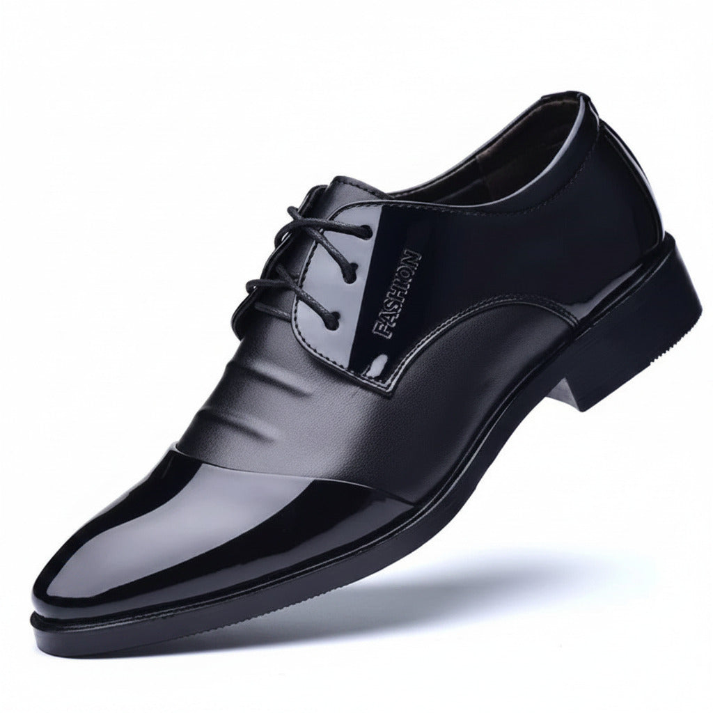 Black leather dress shoe on a white background