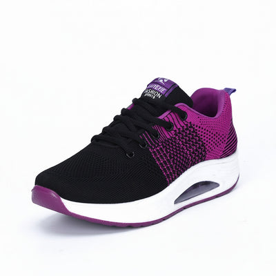 Black and purple sneaker on a white background