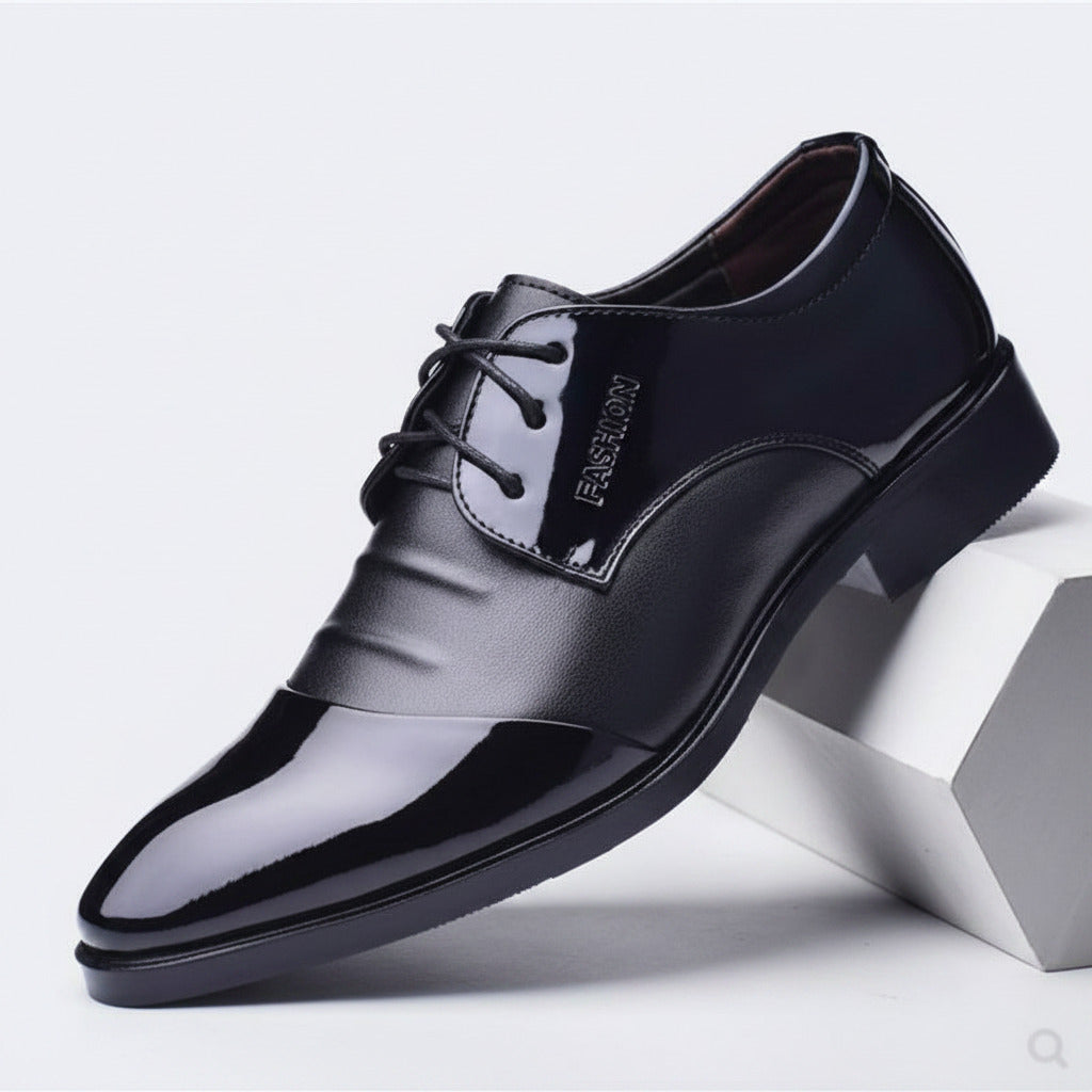 Black dress shoe on a white background