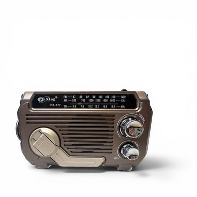 TS Store PX-777 mixed color portable radio with Bluetooth, solar power, and USB. Features tuning and volume knobs.