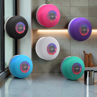 TS Store waterproof Bluetooth speaker with suction cup, available in black, pink, purple, white, blue, and green, features LED lights and controls.