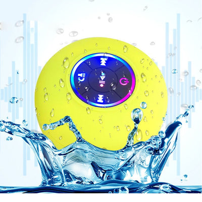 TS Store yellow waterproof Bluetooth speaker with suction cup, illuminated controls, and splash effect.