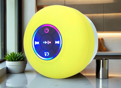 TS Store yellow waterproof Bluetooth speaker with suction cup and illuminated controls, ideal for showers or outdoor use.